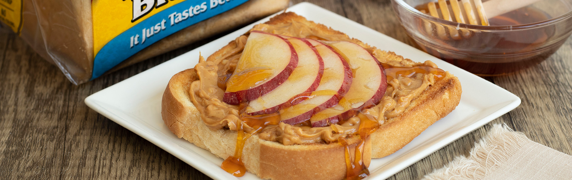 Toast with peanut butter, apples and honey on Sara Lee Butter Bread