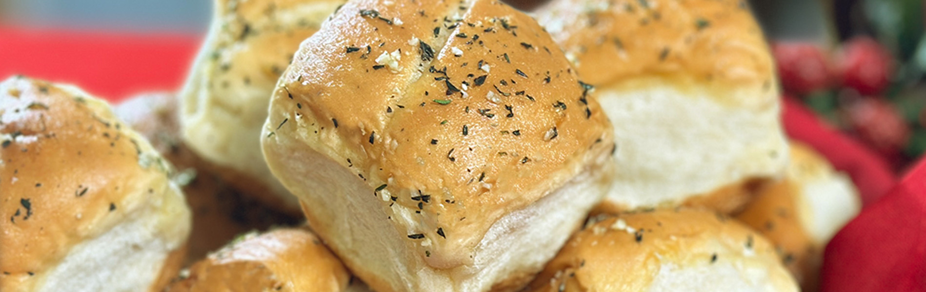 Artesano Bakery Rolls topped with garlic butter, rosemary and thyme 